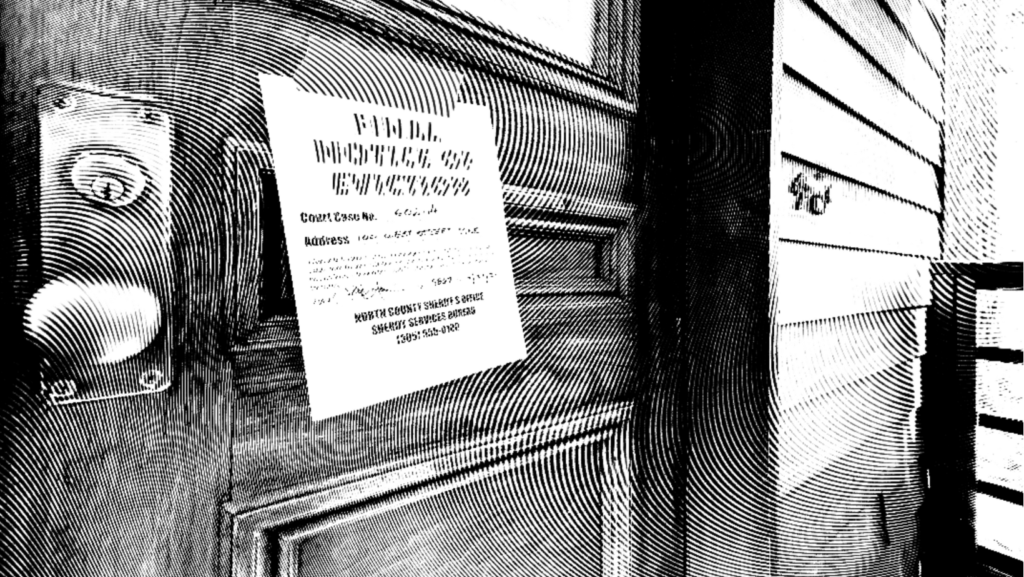 Door with a final notice of eviction taped to it